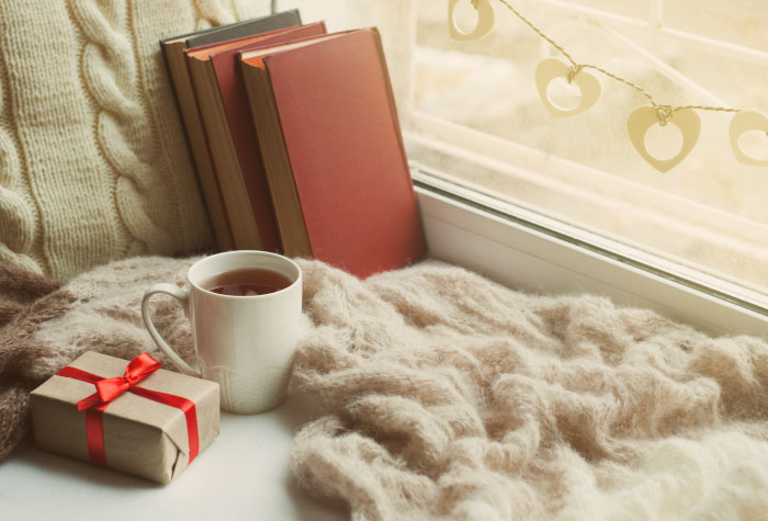 book blanket coffee window